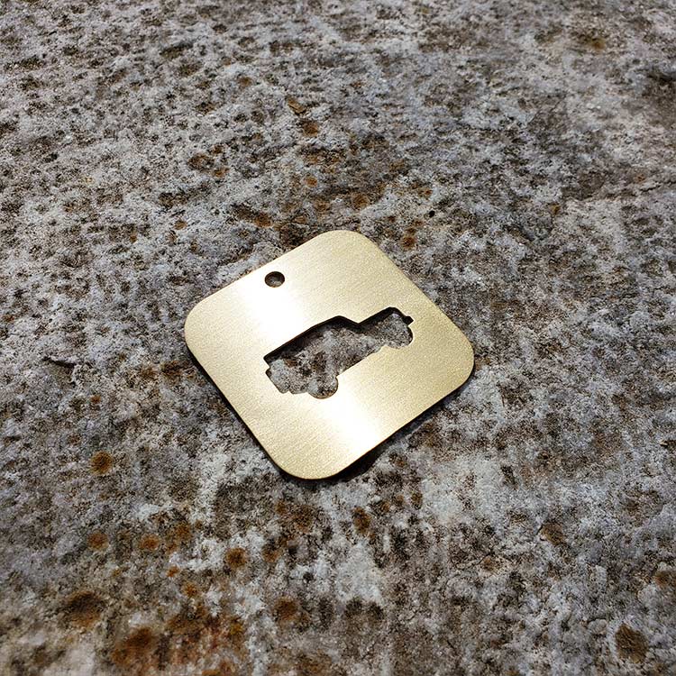 A DEFENDER SILHOUETTE KEY TAG aka THE BOTTLE OPENER