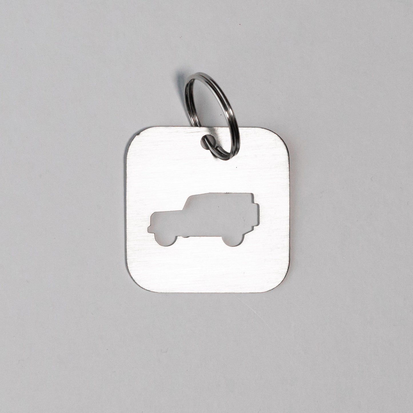A DEFENDER SILHOUETTE KEY TAG aka THE BOTTLE OPENER